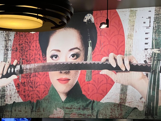 LadyHoldingSwordByEdge